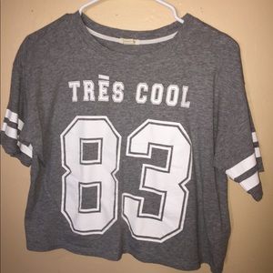 Gray tee shirt with striped sleeves and a number